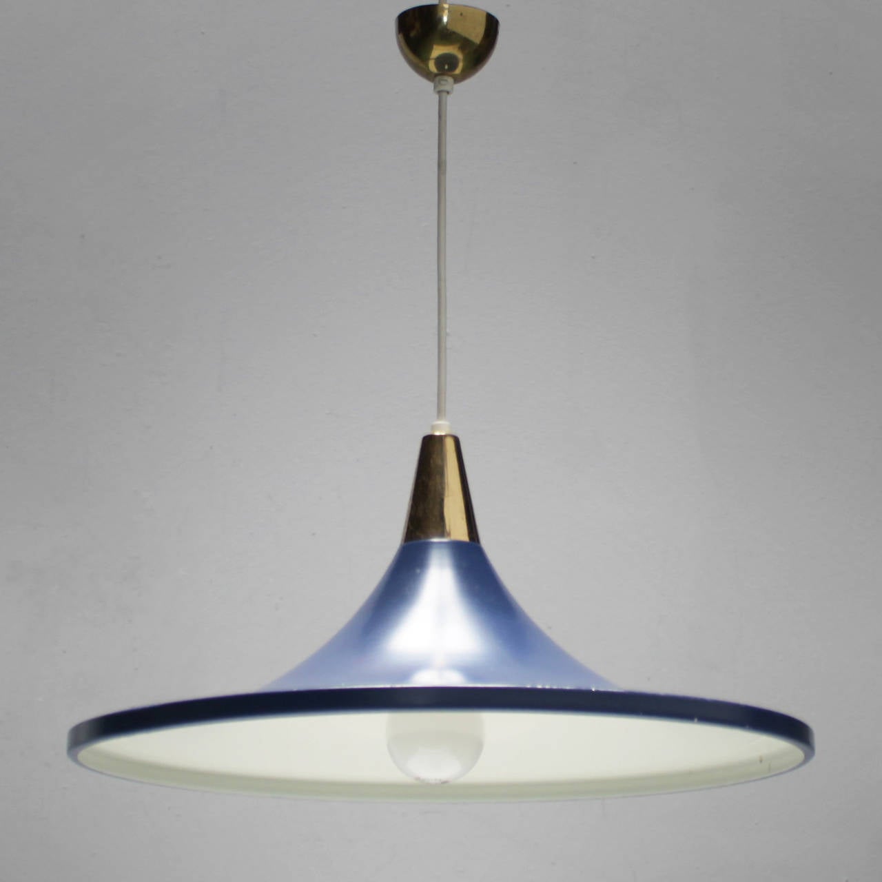 Rare blue pendant by Stilnovo Italy Milano. Brass with original beautiful blue lacquered shade. Marked. Diameter 17.3 in. (44 cm), height of the shade 7.9 inches (20 cm).