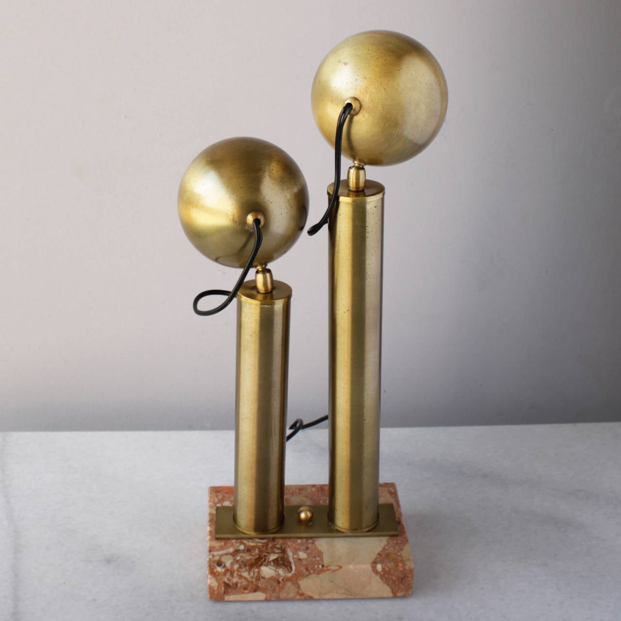 Italian modernist table lamp in the style of Angelo Lelli. This architectural lamp has two adjustable spotlights on a marble base.