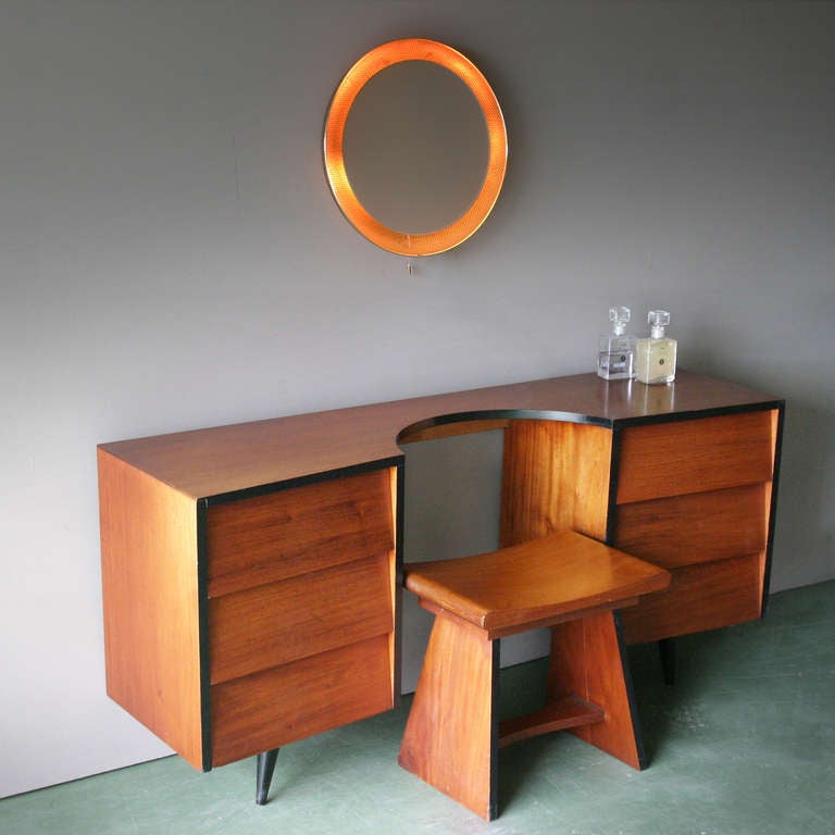Teak ladies dressing table with a stool. Six drawers.
Designer and manufacturer unknown.
Measurements: length: 55.11 in. (140 cm), depth: 15.74 in. (40 cm), height: 25.98 in. (66 cm).