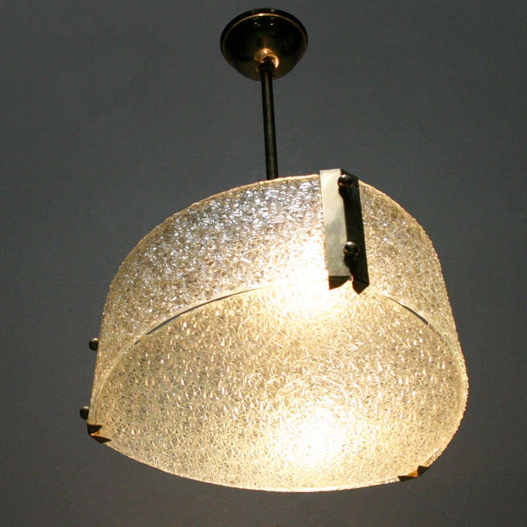 French molded glass pendant from the 1950s, two original French brass bayonet sockets. Beautiful condition.
Measurements: diameter 11.0 inches (28 cm) and height from the ceiling 15.7 in. (40 cm). Height of the lamp 4.0 in. (10 cm).