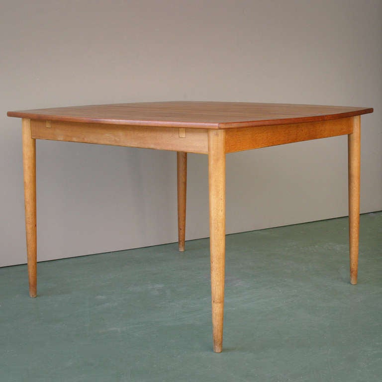 Rare adjustable table by Arne Hovmand-Olsen. Made by Mogens Kold Denmark. Labled. Beautiful condition.
Measurements: height 74,5 cm, length 115,5  cm (189,5 cm), width 115,5 cm.
We have also four chairs of Hovmand-Olsen matching the table.