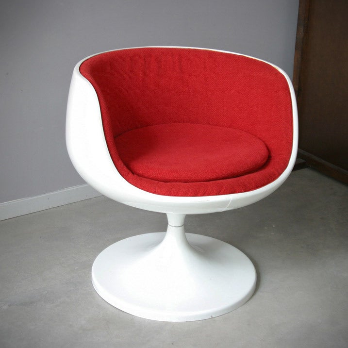 White lacquered fibreglass reinforced polyester seat shell, the interior cushion and seat cushion new covered with red fabric, swivelling mechanism. Not stamped or labeled.
