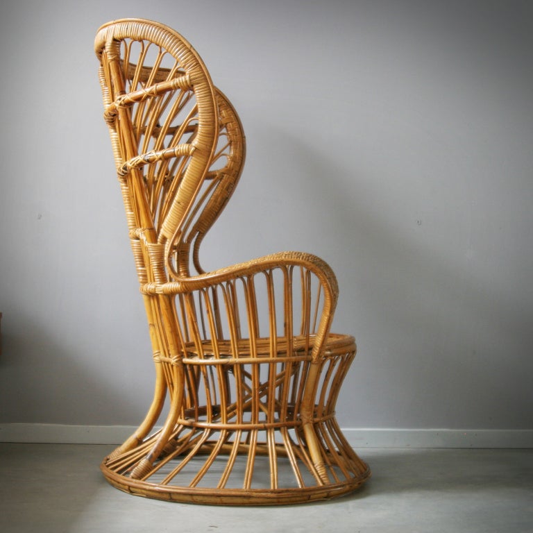 High-back rattan lounge chair designed by Gio Ponti for the interior of the luxury cruise ship 'Conte Biancamano'. Manufactured by Bonacina, Italy. Complete original witha a beautiful patina. Literature: Ugo La Pietra, Gio Ponti, Milano, 1995, p.
