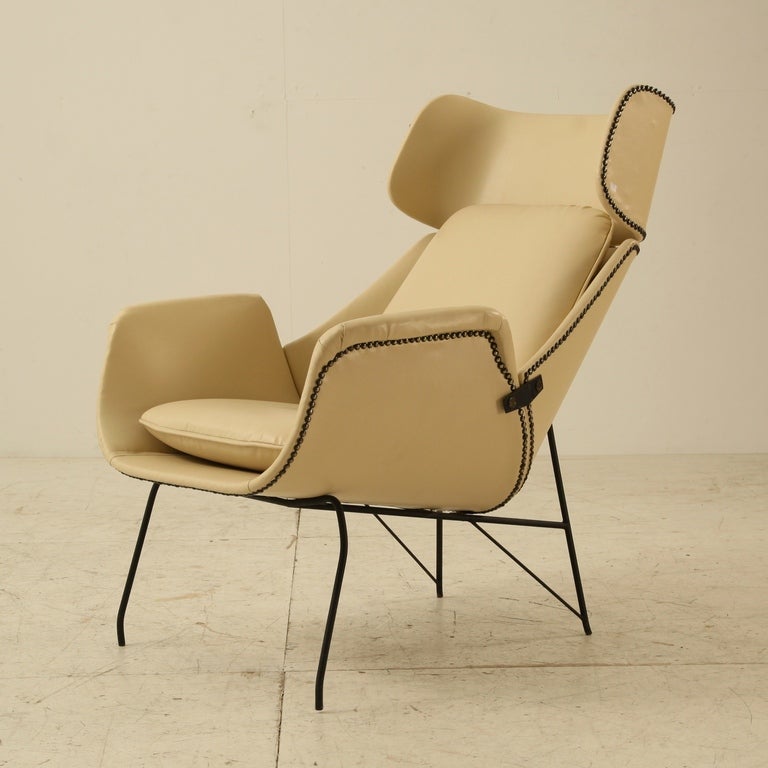 Extremely rare lounge chair, 1950s. Cream white artificial leather on black metal frame. Elegant lining and excellent condition.