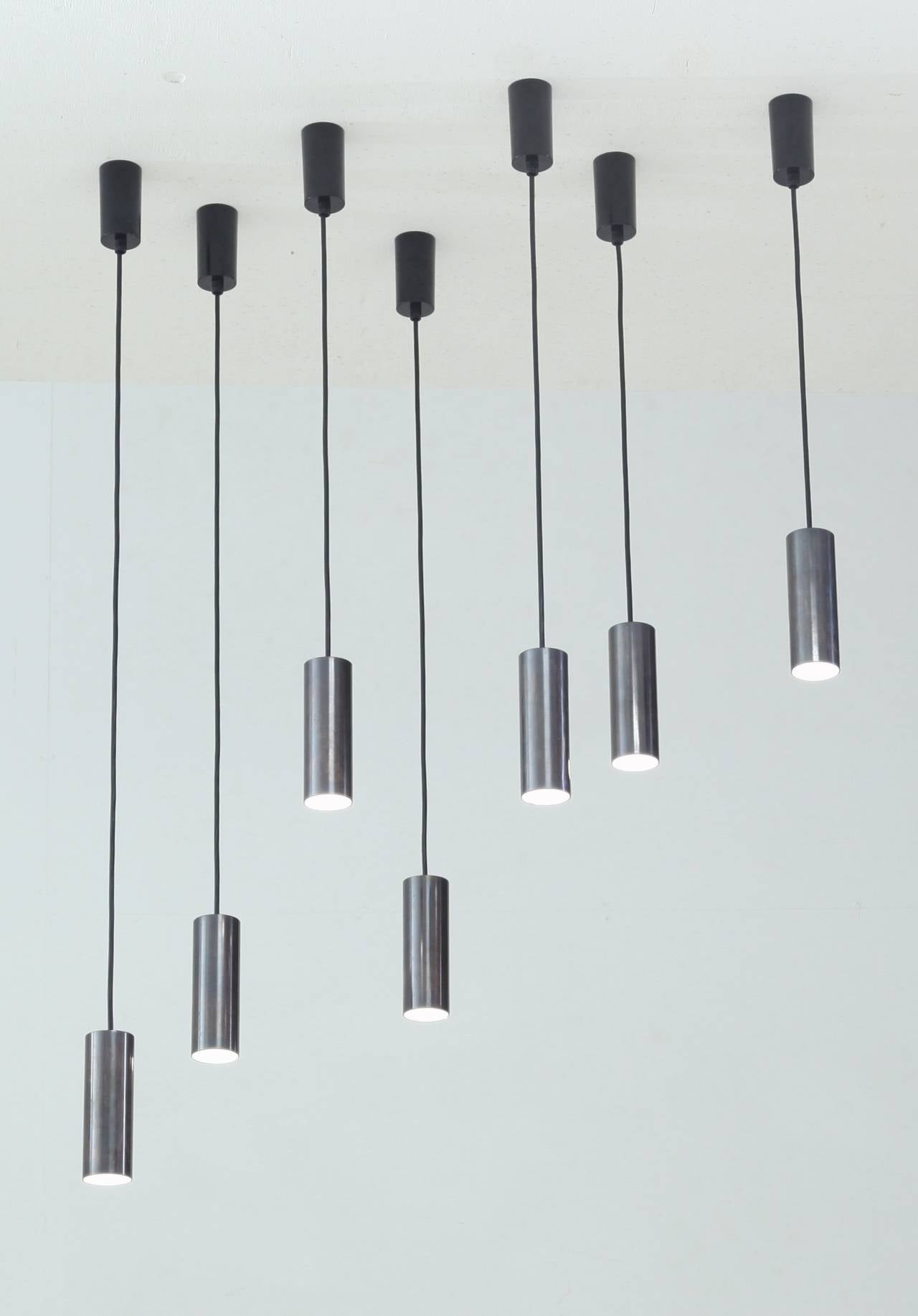 A series of seven pendants that can be hung in a straight row or free configuration.
Steel with a gunmetal finish and ceramic lampholder.