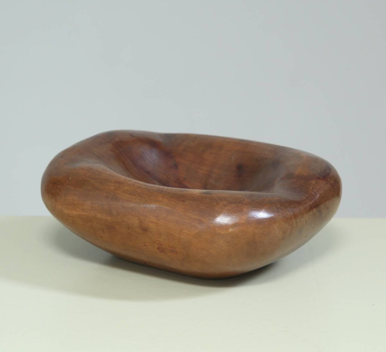 Wonderful, rounded wooden bowl by Alexandre Noll.
It has the typical Noll quality that you want to touch and hold.
Signed by Noll underneath.
