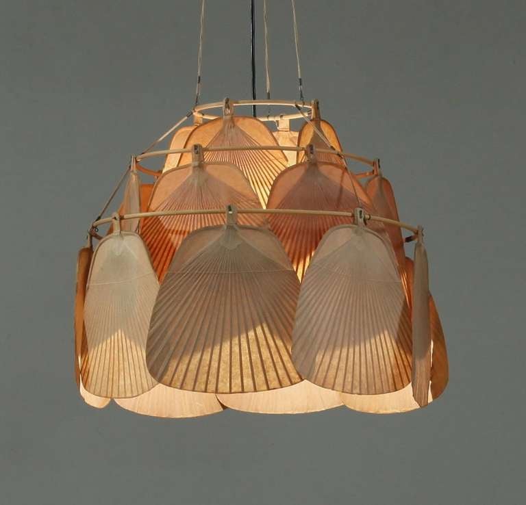 A three ring 'Uchiwa' pendant lamp by Ingo Mauer, consisting of several fans (called uchiwa in Japanese) made of bamboo and Japanese paper. 

Height of the lamp itself is 44 cm, total drop as listed is 127 cm.
Drop can be adjusted.