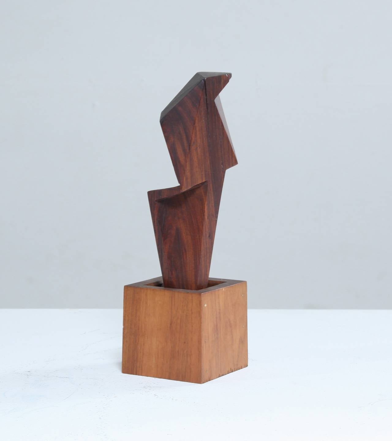 A small cubist sculpture in wood by David E. Rogers.

Dr. David Elliott Rogers (1926-1994) was, amongst other functions, co-chairman of the National Commission on AIDS. Apart from his medical work, Rogers was an accomplished woodworker and