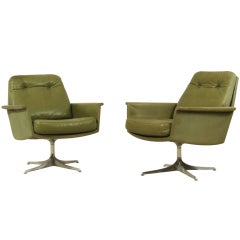 Pair green leather swivel chairs by Horst Bruning