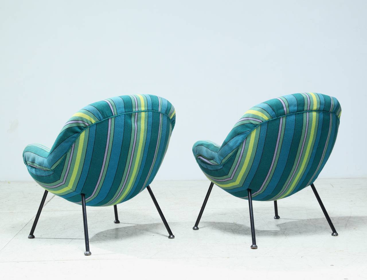 A pair of Fritz Neth lounge chairs on tubular steel legs. This model was designed in 1955 by German designer Neth for Sitzformbau, Kassel.

These chairs were published in Das Möbelbuch, 1958.

The chairs have been reupholstered with a striped