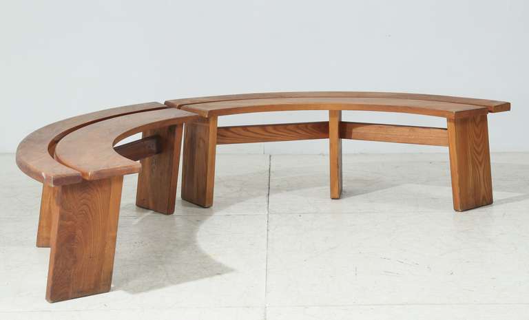 A set of two wooden 'S38' benches by Pierre Chapo. These benches have the shape of a quarter circle and are perfect to place around, for instance, Chapo's 'T21' table.