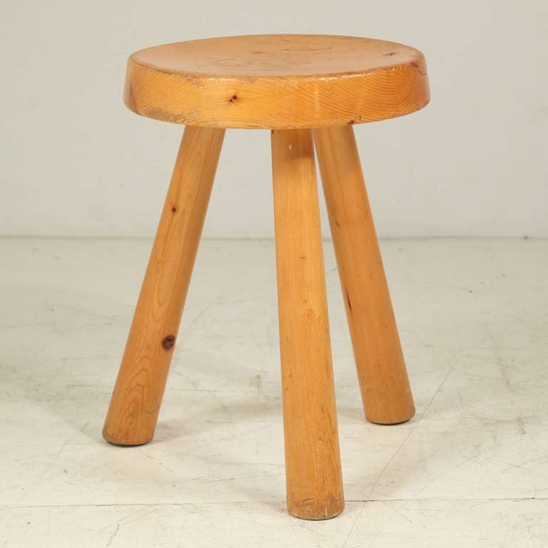 A tripod stool by Charlotte Perriand from the Arc 1600 ski resort in Les Arcs (1967-69), built by a team of architects, including Perriand.
