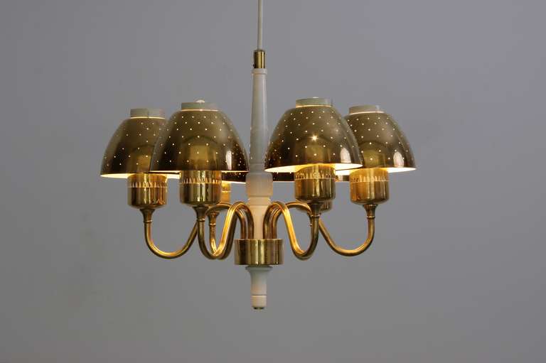 Swedish pendant lamp made by the lighting manufacturer Markaryd in the 1960's and designed by Hans Agne Jakobsson.  It's in fully working order. The brass lamp shades have blemished a bit over the years, which can be seen by the pictures added