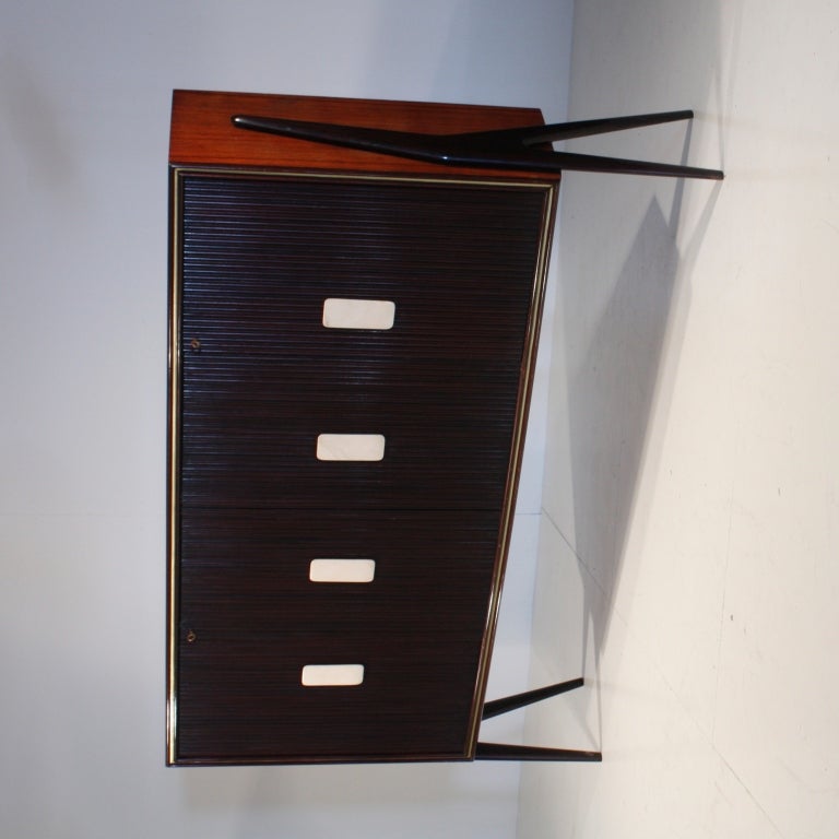 A large and elegant highboard, attributed to Italian designer Vittorio Dassi, from the 1950s. It is made of mahogany with rare alabaster rounded grips. Other nice details are the polished maple on the inside, the dark finish on the outside and the