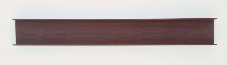 A wooden wall-mounted shelf by Walter Wirz for Wilhelm Renz. Ideal for  glasses, ceramics or other decorative objects.