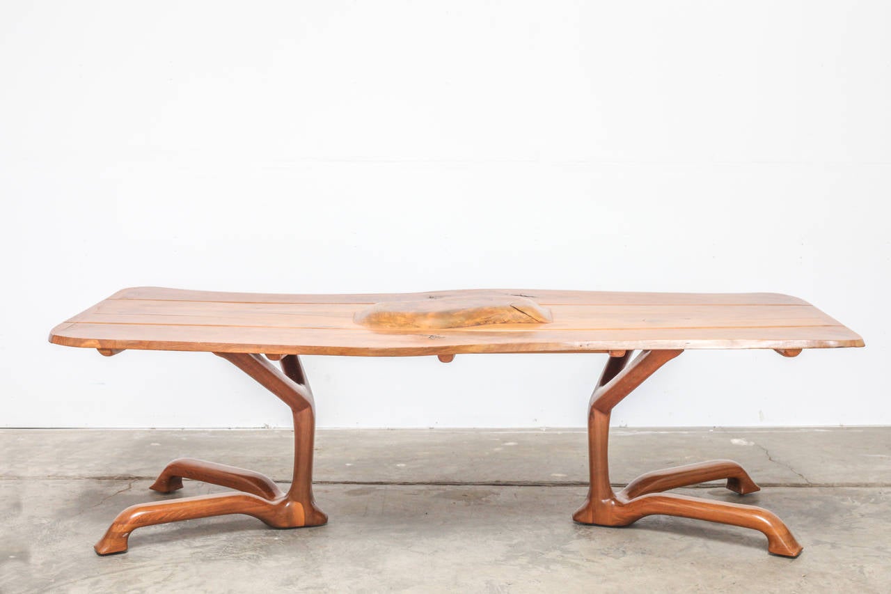 A studio crafted sculptural, zoomorphic 'wooden touch' table by American woodworker Ejner Pagh. The legs of this walnut table resemble those of an animal.
This piece was bought directly from Ejnar Pagh and is signed with the year of production
