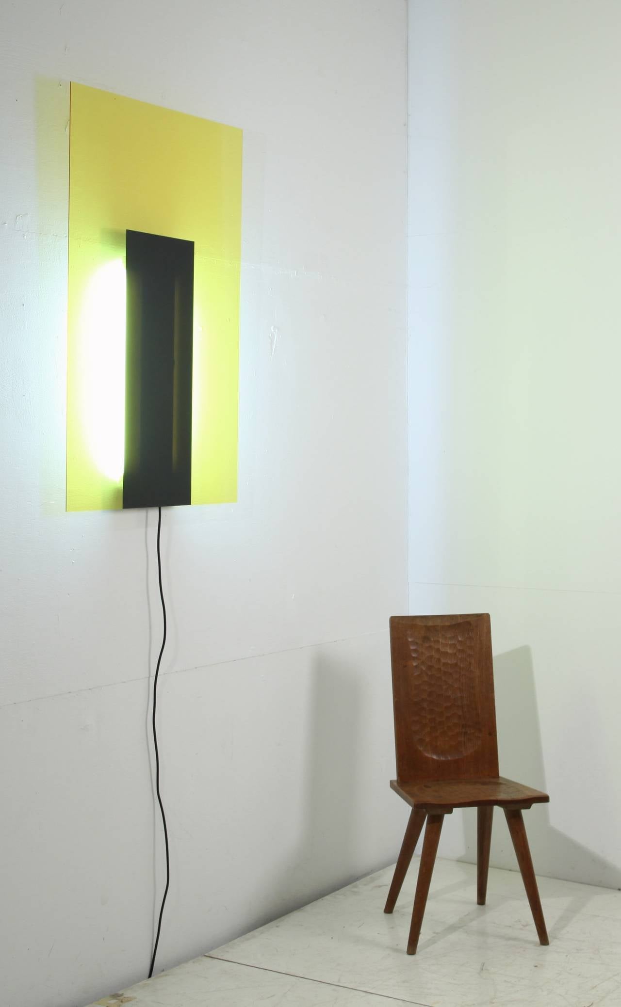 Meta Memhis wall light in yellow and black by Johanna Grawunder.

Johanna Grawunder is a designer and architect based in Milan and San Francisco.

Her work spans a broad range of projects and scales, from large-scale public installations,