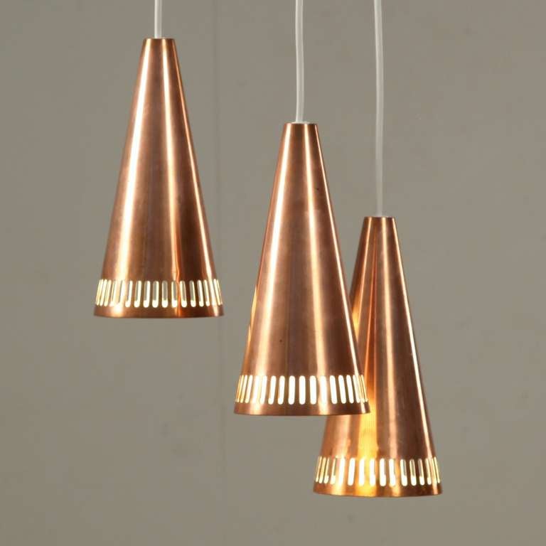 Massive copper cascade pendant lamp by Mauri Almari
Enameled on the inside with beautiful copper canopy.