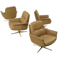 Set of 4 greige leather lounge chairs with swivel by Horst Bruni
