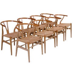 Set of 8 Hans Wegner Wishbone Dining Chairs in oak by Carl Hansen