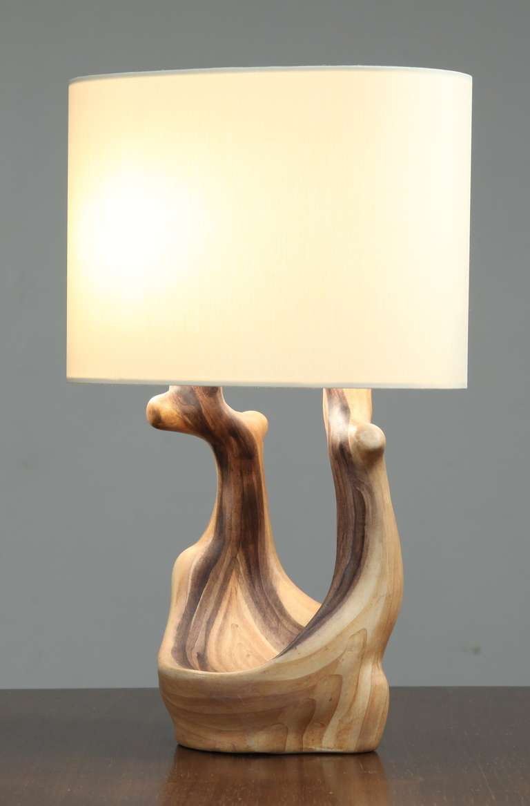 A faux bois (wood-like) ceramic table lamp holding two light bulbs and in a wonderful condition. This lamp is made by Grandjean Jourdan of Vallauris, France and marked by Jourdan underneath.