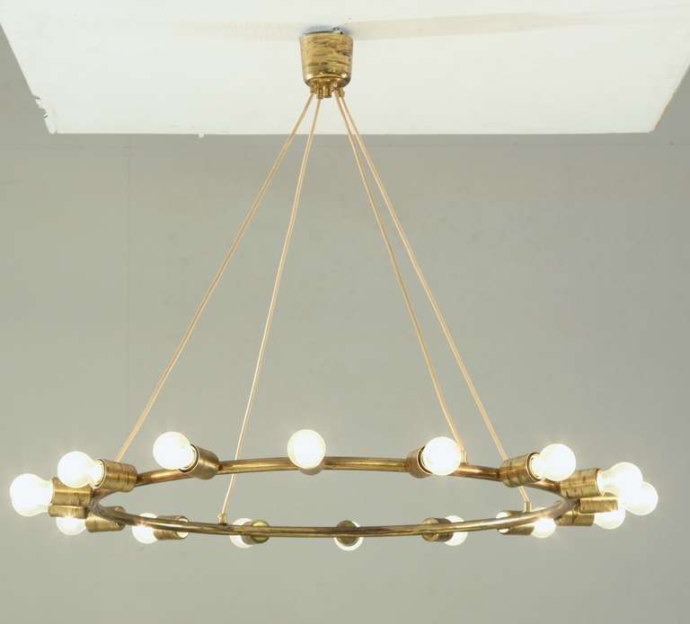 Mid-Century Modern A large and minimalistic brass circular chandelier