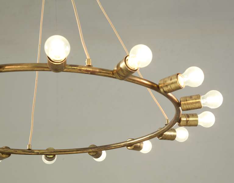 Brass A large and minimalistic brass circular chandelier