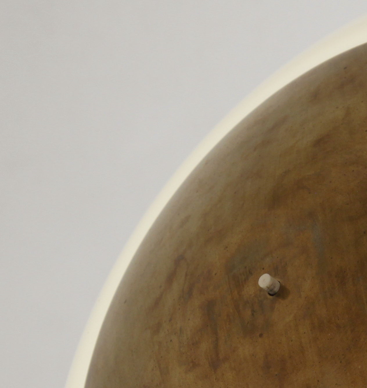 A rare and early model 5061 table lamp by Paavo Tynell, visibly marked with 'Taito' and the model number.
The lamp is made of a heavy brass base and stem with an opaline glass shade, with a smaller brass cap on top.