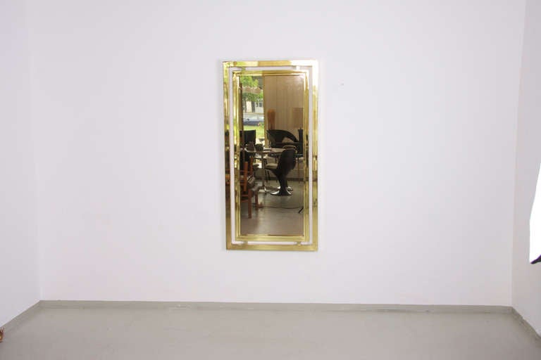 Rare Guy Lefevre mirror for Maison Jansen with golden frame.