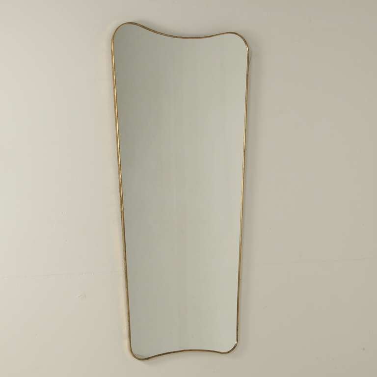 Pair 1950s Gio Ponti wall mirrors framed in brass.Beautiful light patina at the brass. wonderful pair.