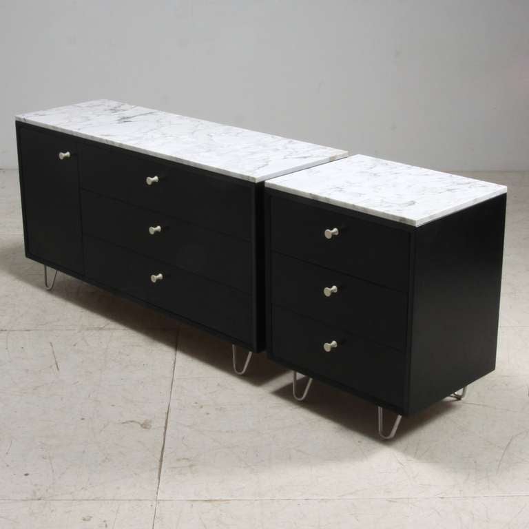 Pair of chest of drawers by George Nelson for Herman Miller with white ceramic pulls, hairpin legs and marble top.

Dimenions small chest: 76.5 x 61 x 47 (hxwxd in cm)
Dimensions wide chest: 76.5 x 143 x 47 (hxwxd in cm)