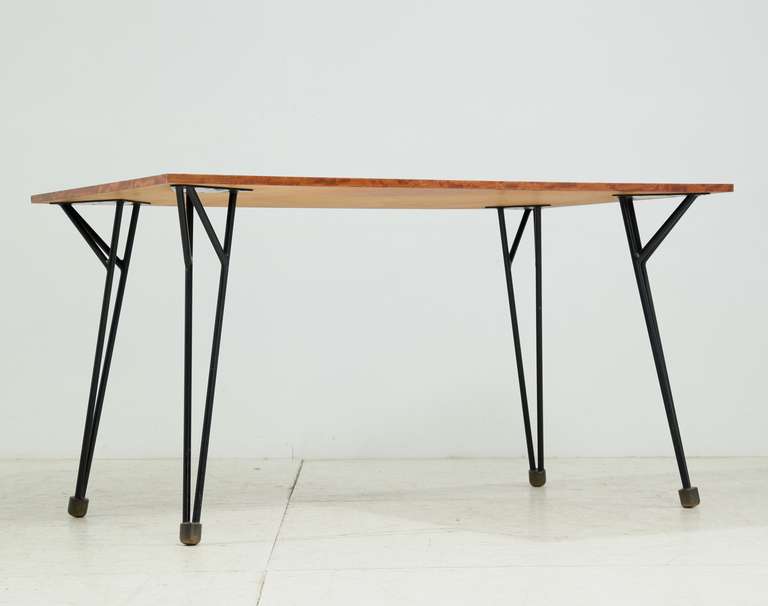 A rare Alfred Hendrickx work desk or dining table, designed circa 1958 and produced by Belform, Belgium.

The top is made of wood with a root wood veneer and a frame of black tubular steel with massive brass feet. An extremely rare table and in