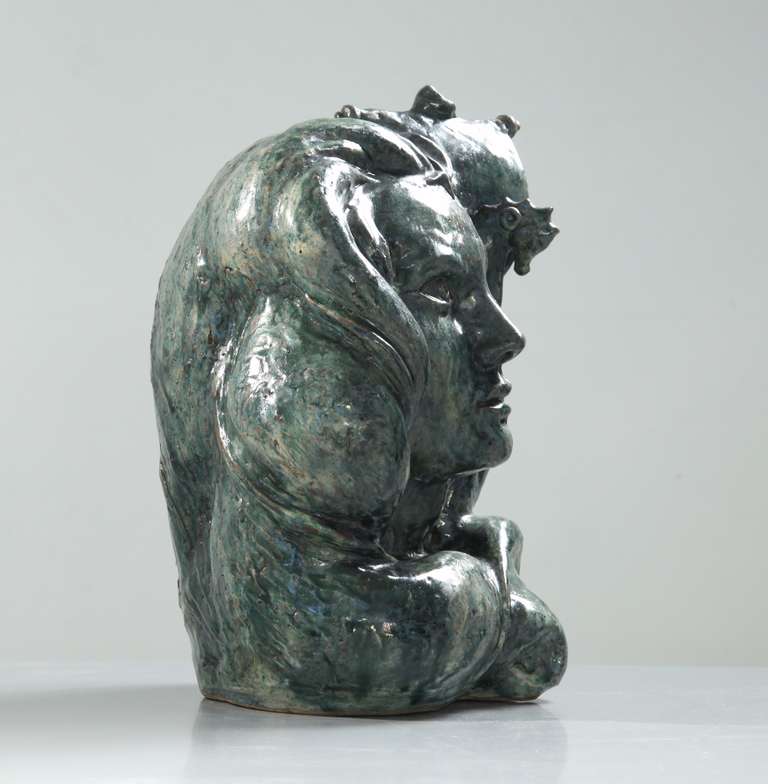 A beautiful and large sculptural head by Andre Rozay.
It is glazed in a wonderful grey and blue tones and combines a Madonna face with a ship in the waves.
Signed by Rozay with the year of creation, 1947.