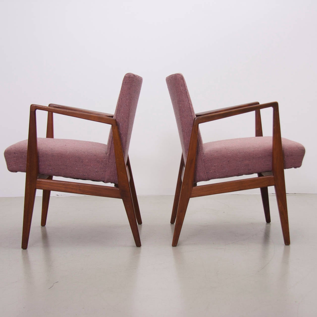 Very beautiful pair of Jens Risom Ocasional Chairs for Jens Risom Inc. in original pinkish wool fabric. Very elegant!! The solid walnut frame shows a great patina.