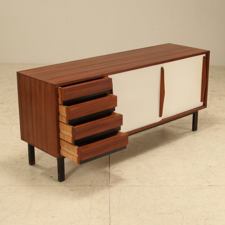 Charlotte Perriand Cansado sideboard in mahogany with  rare double white sliding doors, produced by Steph Simon 1958.
The sideboard is from Cité Cansado, Mauritania, Africa. It has been very professionally restored in France. When enlarging the