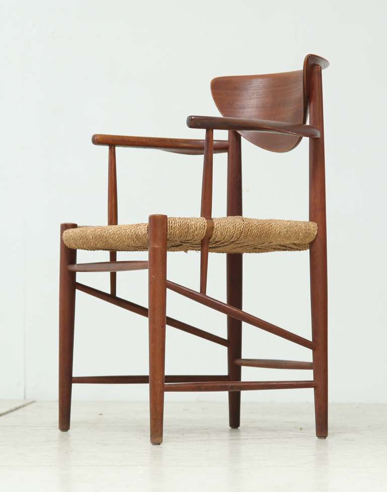 Rare desk chair by Peter Hvidt & Orla Mølgaard Nielsen with a curved back and seagrass seat. Perfect condition.