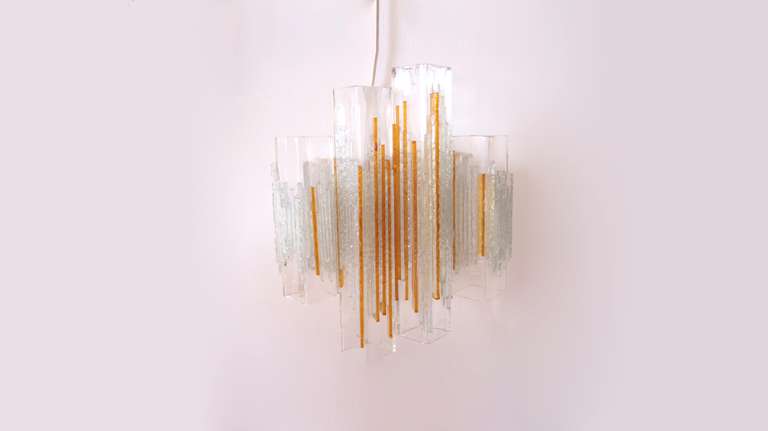 Great original vintage glass wall sconces. Made of cubic glass elements and rough colored glass strips mounted on an aluminum wall fixture. Stylish three dimensional composition.
