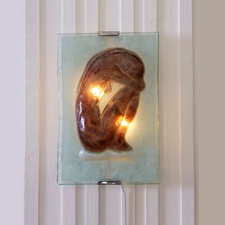 Something special. A large glass wall light. Three dimensional handcrafted glass panel on a chrome wall mount. Unique! In a good condition. One chip on the glass corner down left.