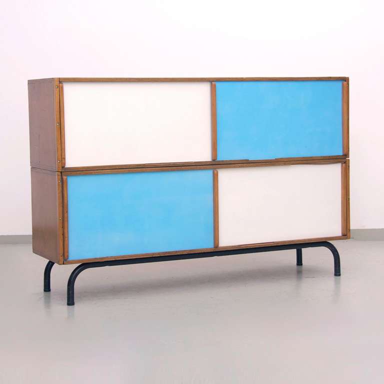 This 1950s French sideboard in oak and steel base provides two levels and therefore two sliding doors. The doors are painted a beautiful white and blue!! In a very good condition