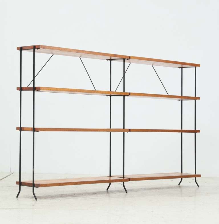 Cast iron frame withw arm wooden shelves. Wonderful room divider and shelve unit.