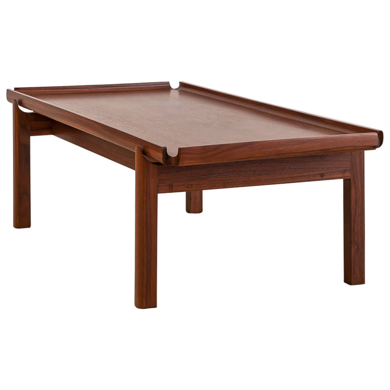 A low, rectangular coffee table with edges that curve upwards.
The table is branded with 'John A. Kapel, designer' and is in an excellent condition.
From the 1950s on, Kapel designed for furniture companies Glenn of California and Brown and