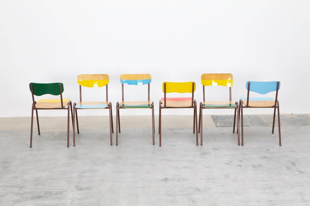 A series of six chairs from the Flitter Flatter series by Marcus Friedrich Staab.
He renews vintage school chairs with each an individual combination of added color and deformation, making them bright and joyful, yet keeping the vintage character