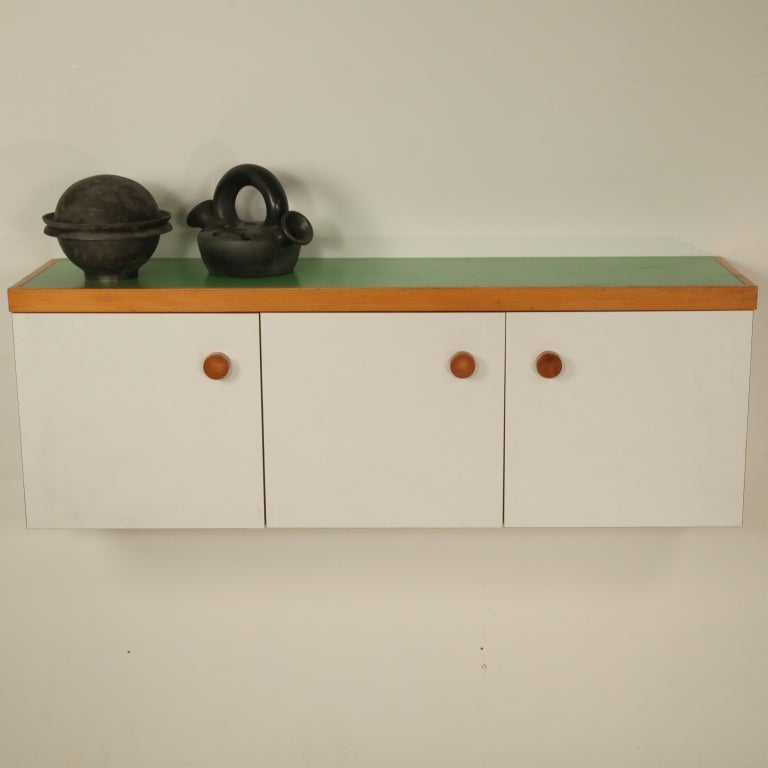 This cabinet originates from the Arc 1600 apartments in Les Arcs, France. Simple and lively combination of the pine, white formica and green top. Excellent condition.
