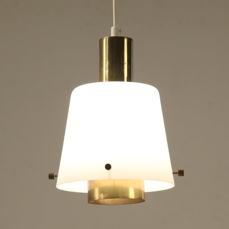 Wonderful glass and brass Itsu lamp in perfect condition. This lamp is in the style of Finnish designers like Lisa Johansson-Pape en Paavo Tynell.
