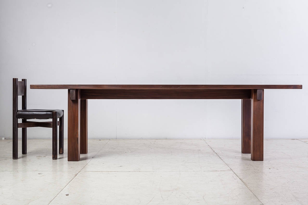 A stunning 'Brazil' table by Charlotte Perriand in a beautiful dark teak. Perriand originally designed and used this table herself as a console table for the apartment of her husband in Rio de Janeiro. It has the great Perriand combination of solid