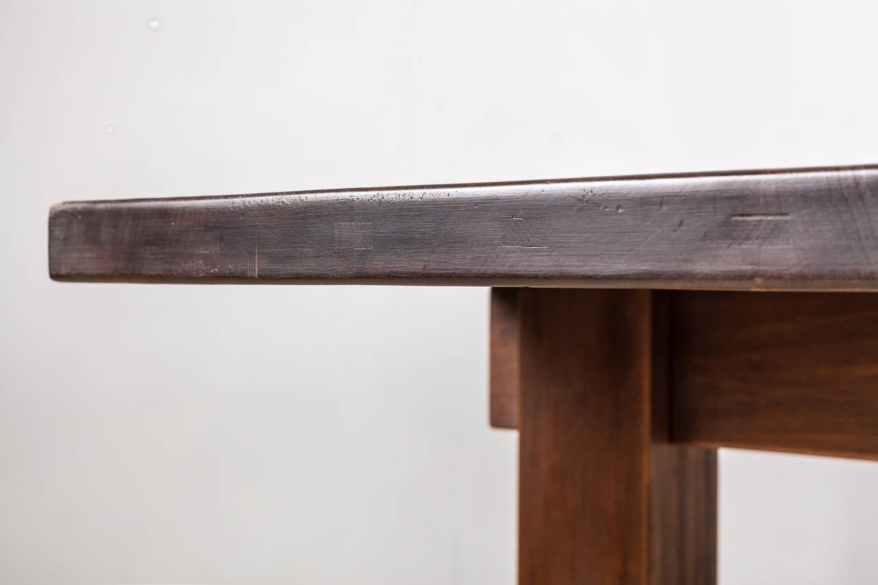 French Rare Charlotte Perriand Brazil table in dark teak, France, 1960s For Sale