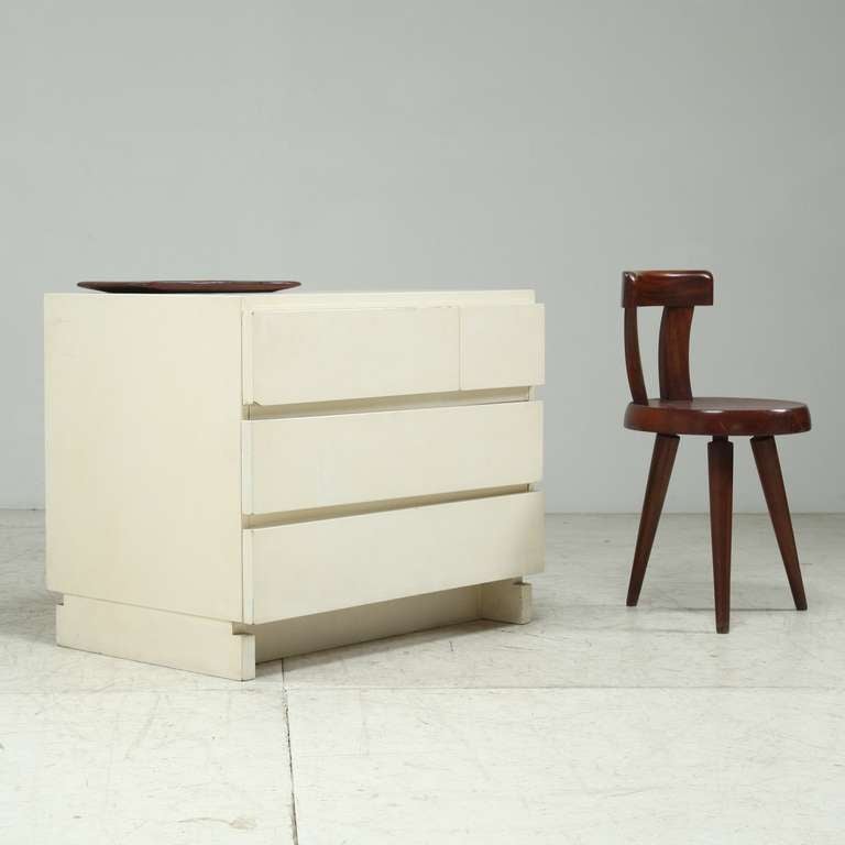 White chest of drawers by Artek, Finland.
The top drawer has two sections, the other two are over the full width.
