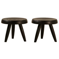 Rare pair black Charlotte Perriand low stools