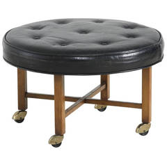 Round Ottoman on Wheels in Black Leather