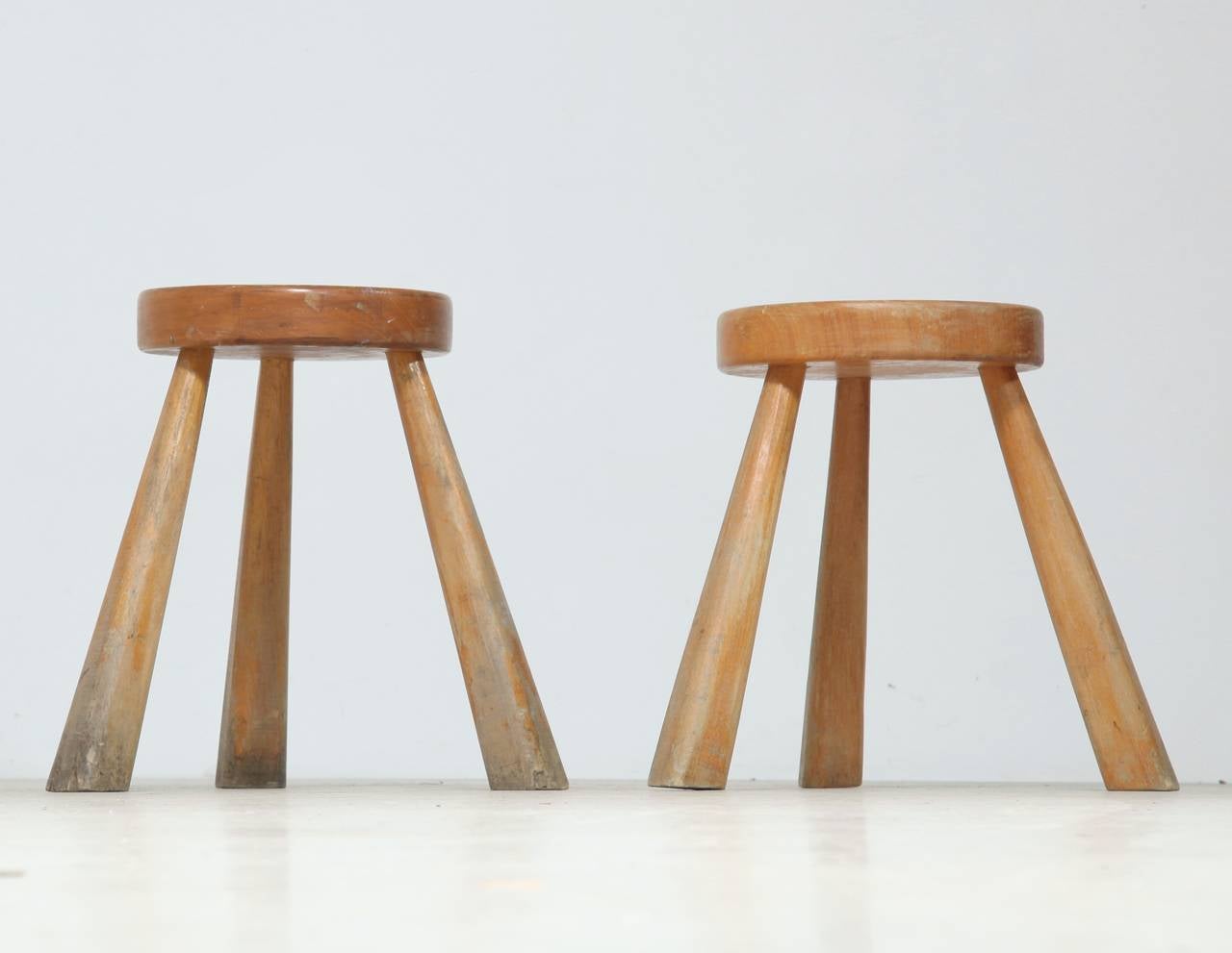 Pair of medium high Charlotte Perriand stools from Les Arcs.
Both beautiful aged, one more greyish in patina.